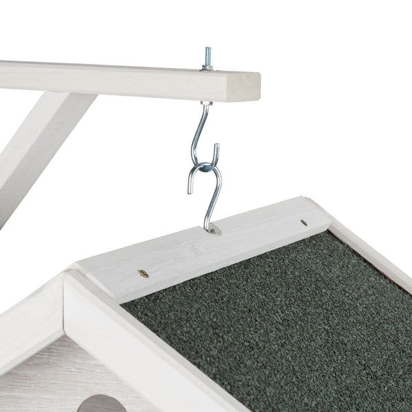 Weiße hängende Vogelhäuschenwand