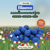 Blauwe zaadbommetjes van bloeirijk in een bloemenweide